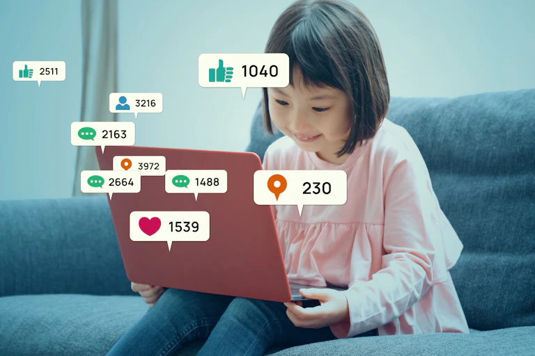 Little girl checking social networking service.
