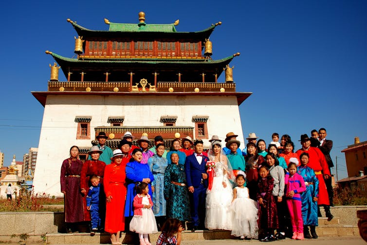 A large family photo at a wedding.