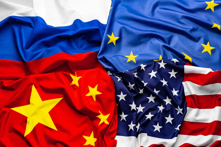 A composite image showing the US, European, Russian and Chinese flags.