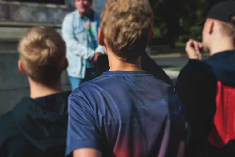 Group of boys seen from back