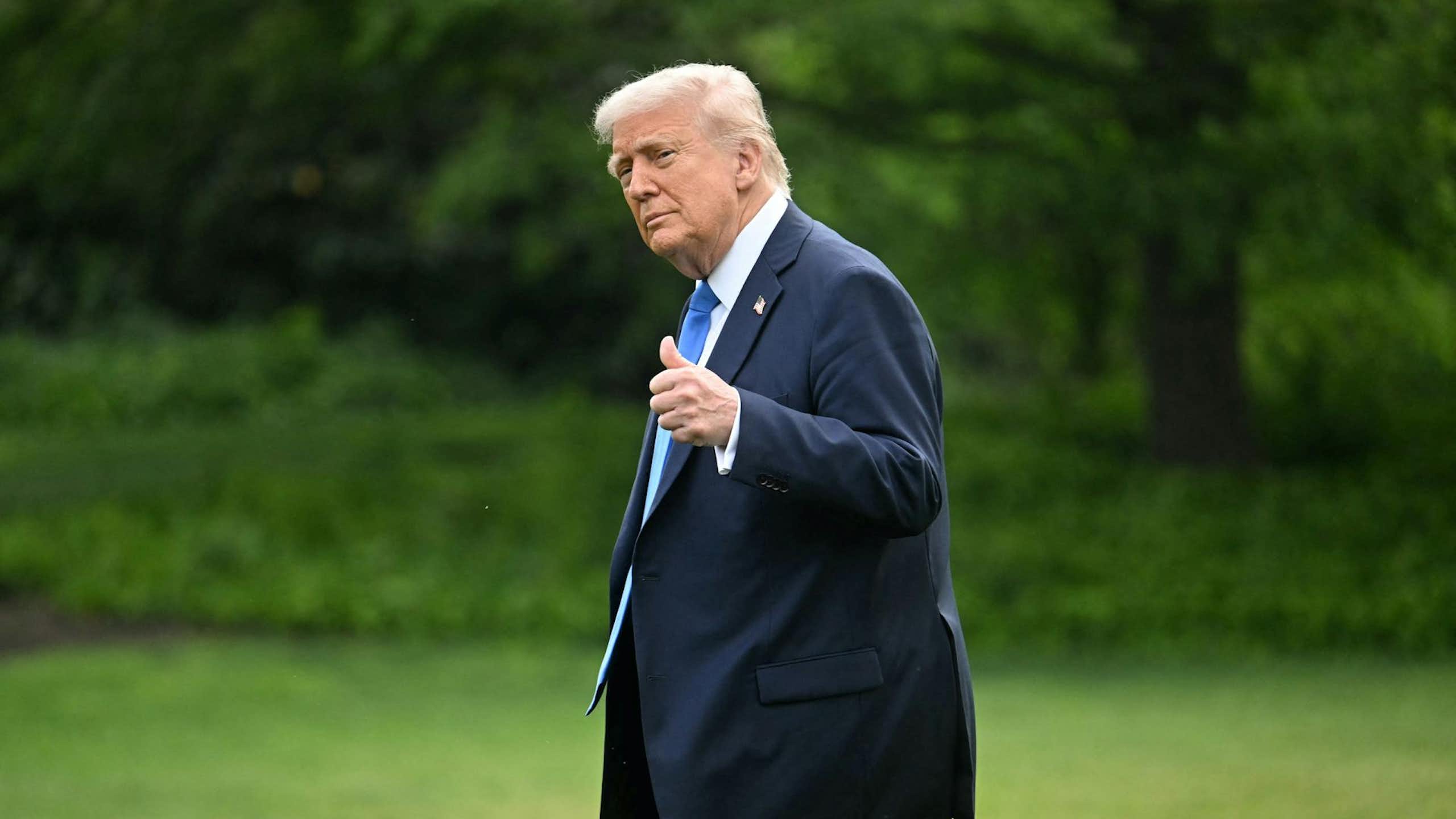 US President Donald Trump walks on the South Lawn of the White House on May 1, 2025.