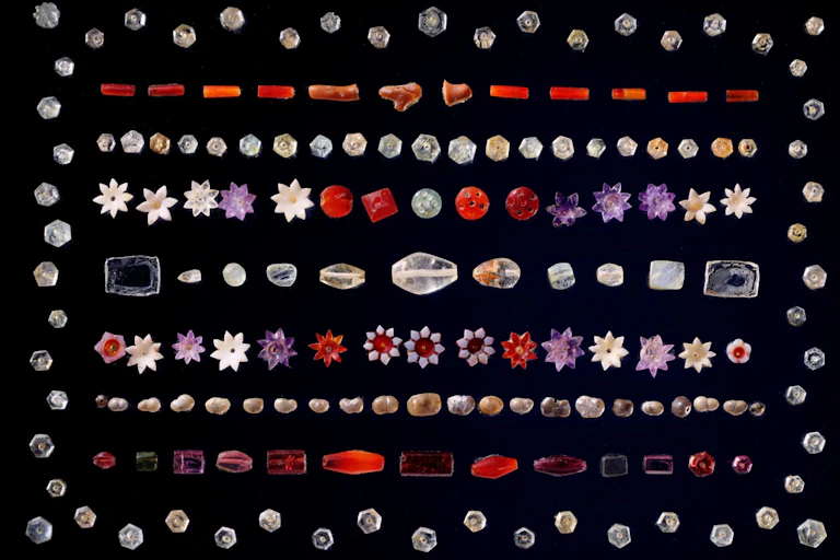 Colourful gem stones laid on a black background