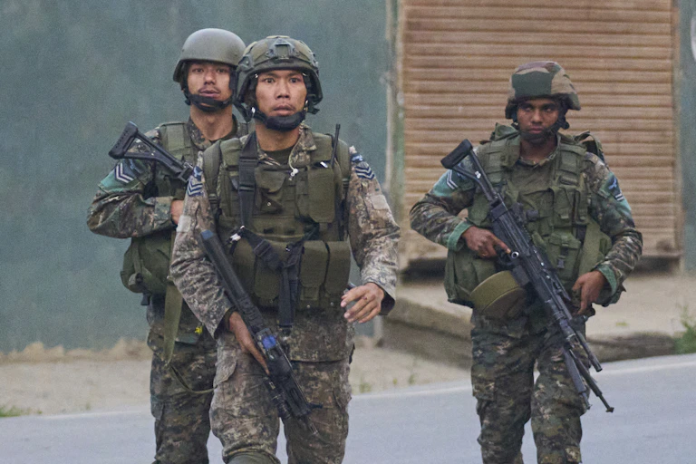 Three armed soldiers