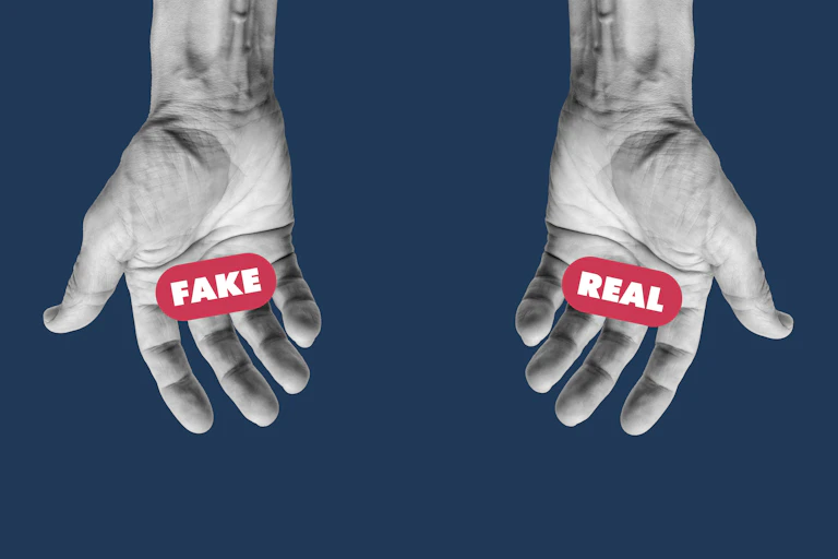 An illustration shows two open hands, one with the word 'fake' in its palm, the other with the word 'real.'