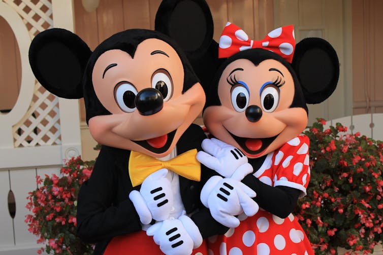Mickey mouse and mini mouse dress up masks. Mikey has no eyelashes and the mini has long.