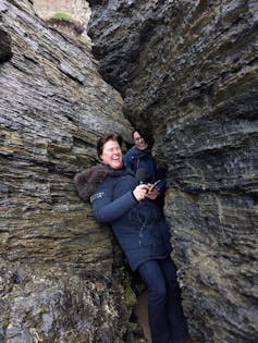Jo and Anna squeezed between beach cliffs