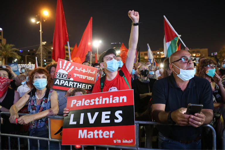 Peace protesters in Tel Aviv mark carrying banners reading: 'Palestinian lives matter'