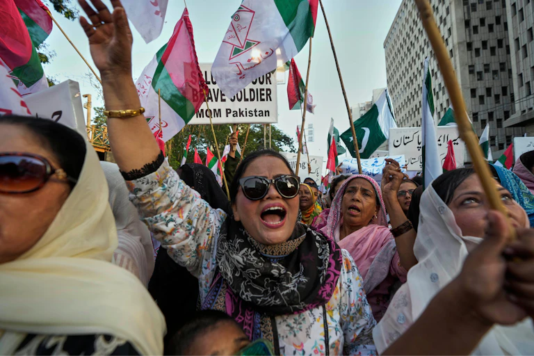 Pakistanis march to protest against India's missile strikes.