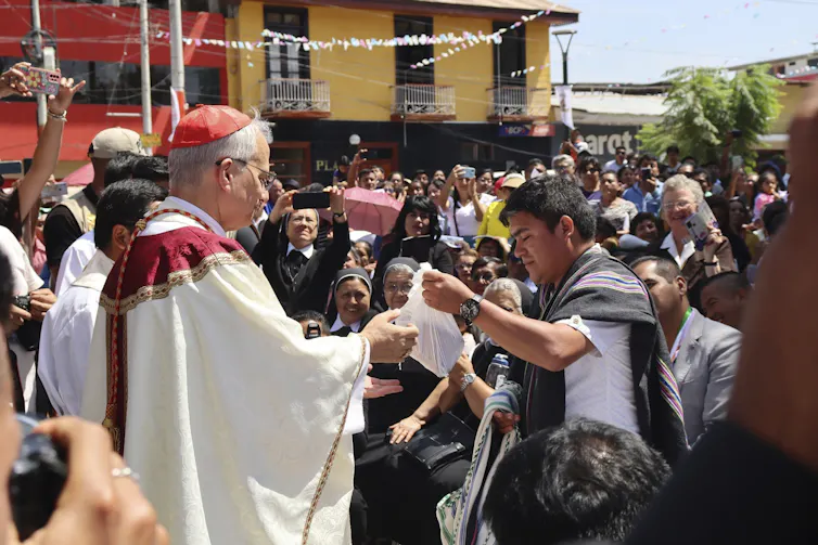 The Bishop in a crowd.