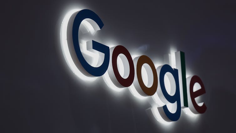 Close up photo of Google logo sign.