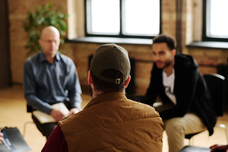 People listen and talk in a group.