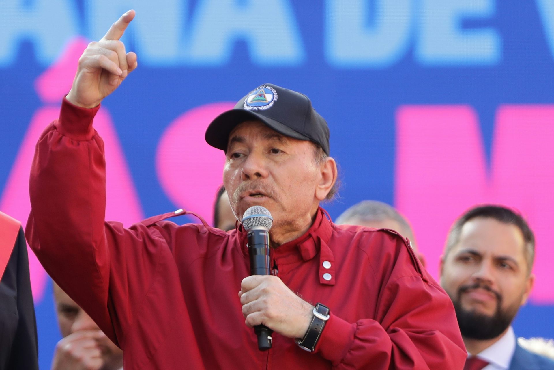 Daniel Ortega wearing a cap speaks during an event in Caracas.