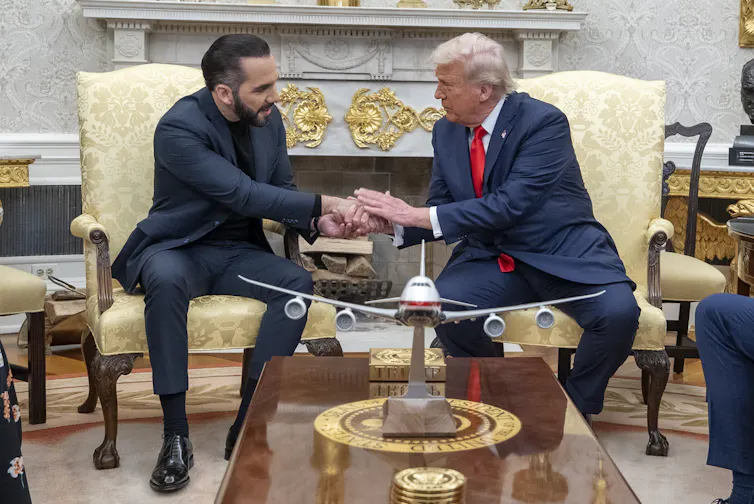 Donald Trump and Nayib Bukele shake hands in the Oval Office.