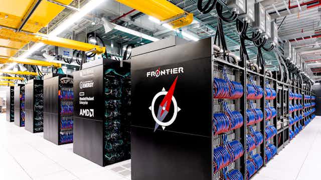 Numerous rows of cases containing racks interconnected by wires