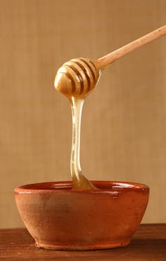 Honey in a terracotta bowl.