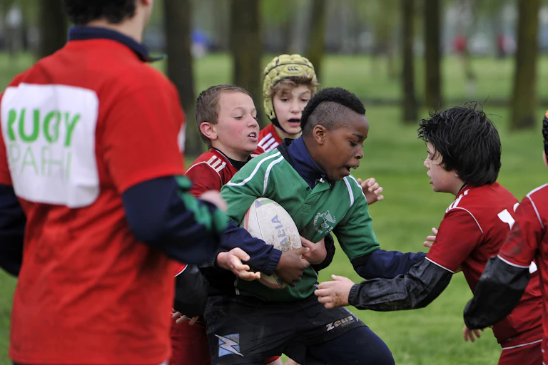 Children competing in a game of rugby