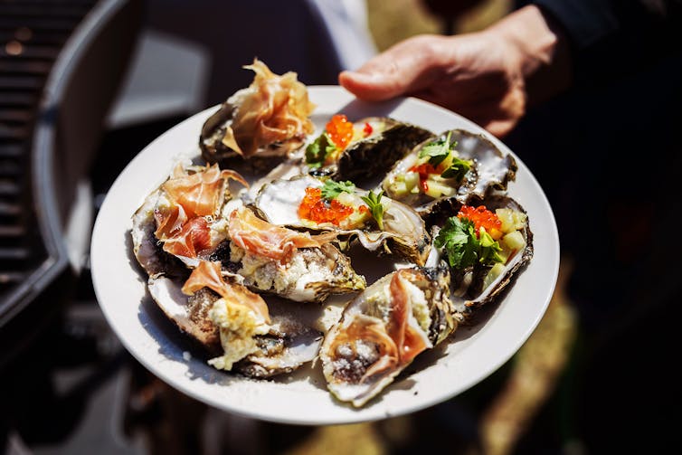 A plate full of delicious Pacific Oysters au Gratin.