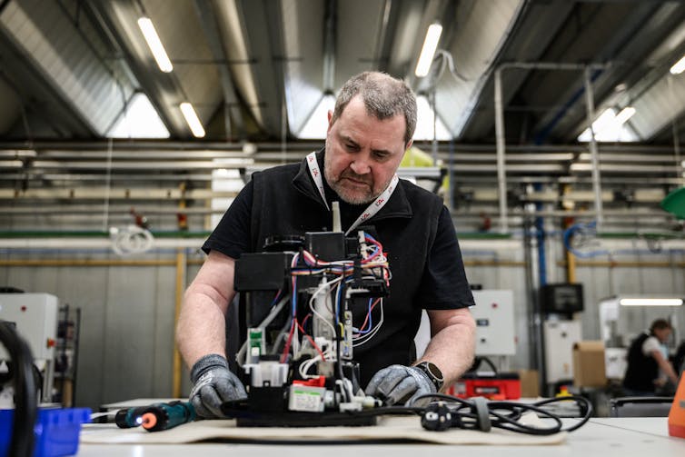Why "throwing recycling" error 1 A man who works in a factory