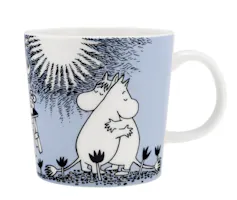 A Moomin mug with Moomintroll and Snorkmaiden.