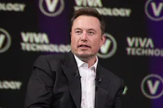 A man with short dark hair.
