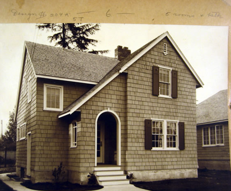 A sepia-toned photograph of a newly-built single-family house.