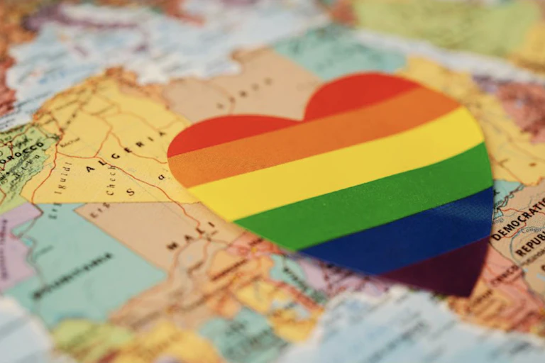 A map of Africa with a rainbow-coloured heart on it.