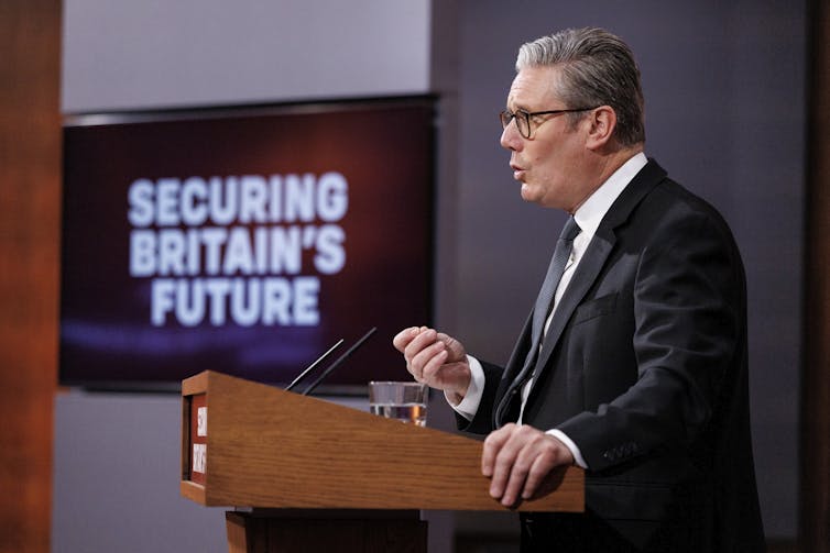 uk prime minister keir starmer giving a speech at a lectern against a sign reading 'securing britain's future'