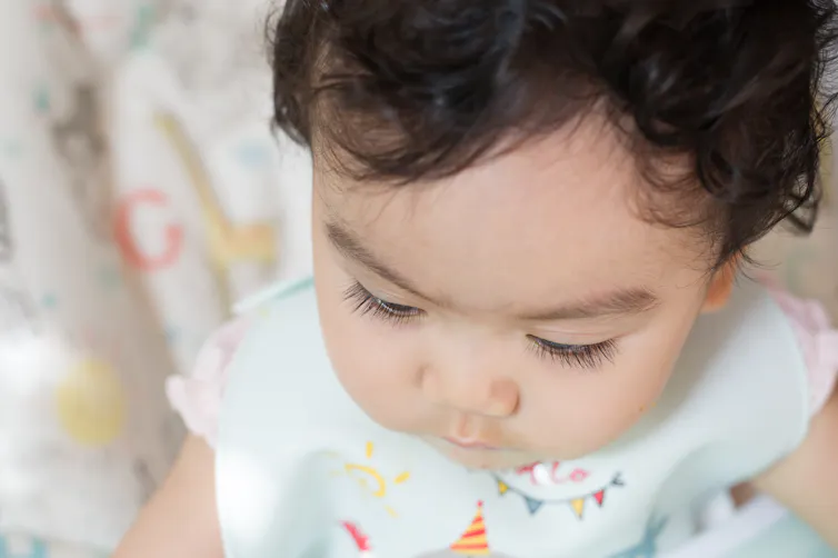 Toddler with long eyelashes.