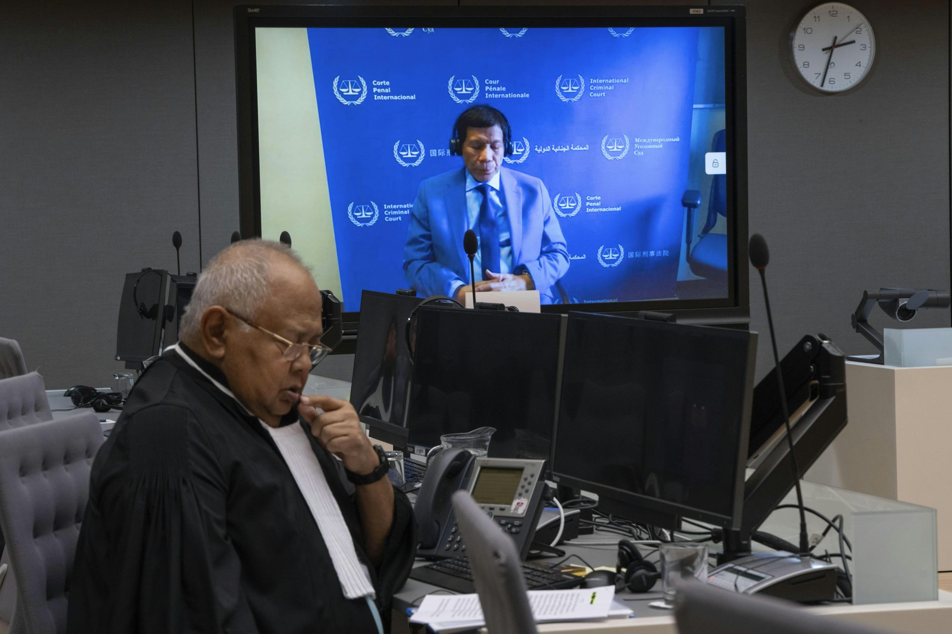 Duterte attends a court hearing virtually alongside his lawyer.