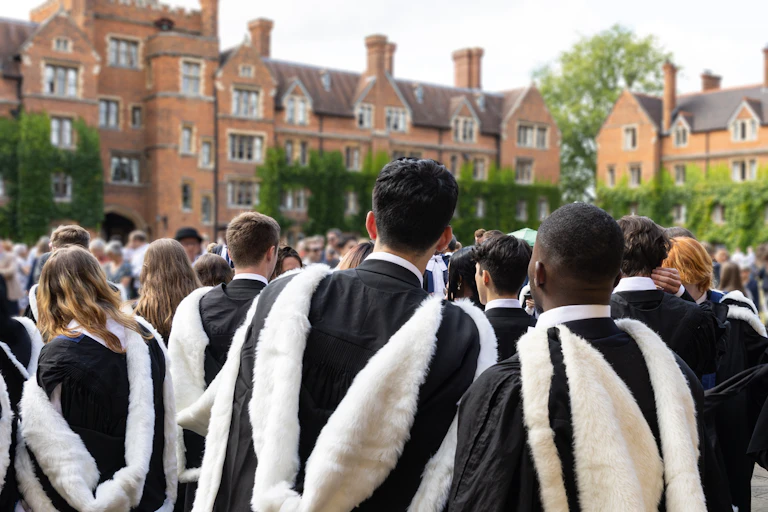 a diverse group of students in gowns