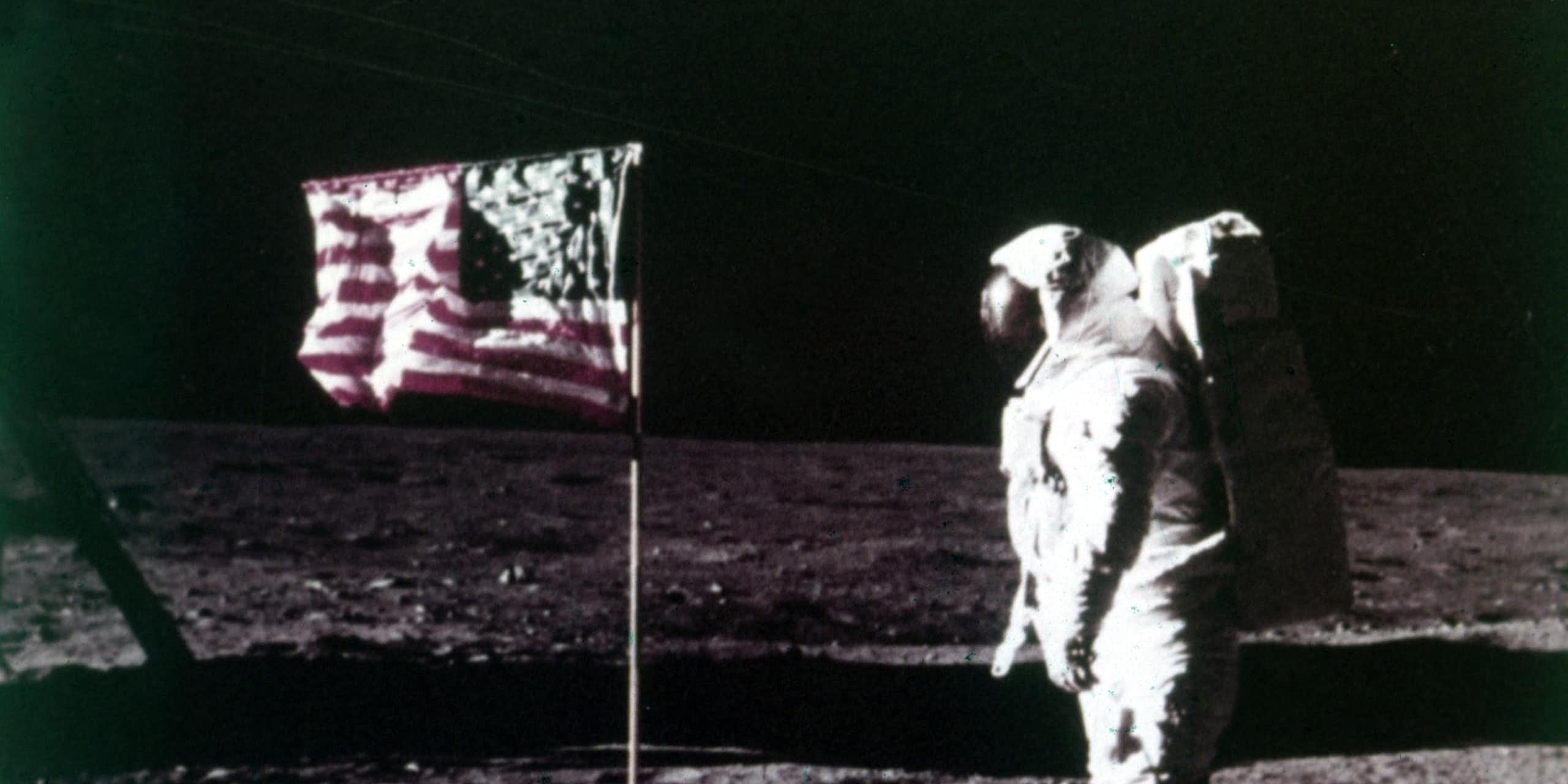 Buzz Aldrin stands next to the American flag on the surface of the Moon, Apollo 11 mission, July 1969.