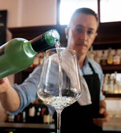 wine being poured into a glass