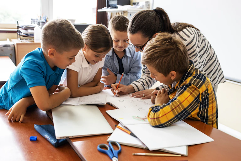 Teacher and children working together