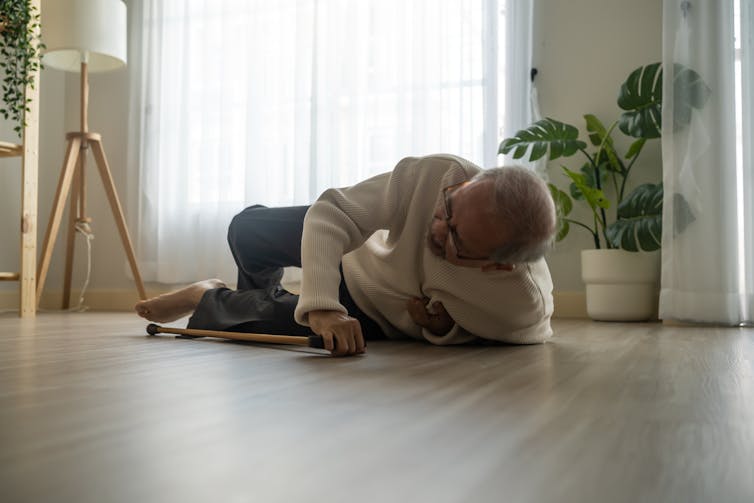 Older man fallen on floor while walking