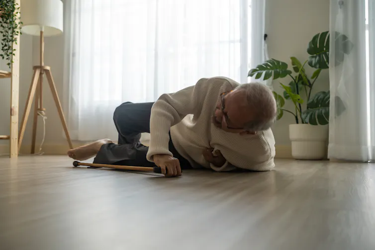 Older man fallen on floor while walking