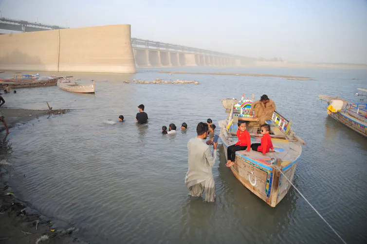People gathered in the Indus River in Hyderabad, Pakistan.