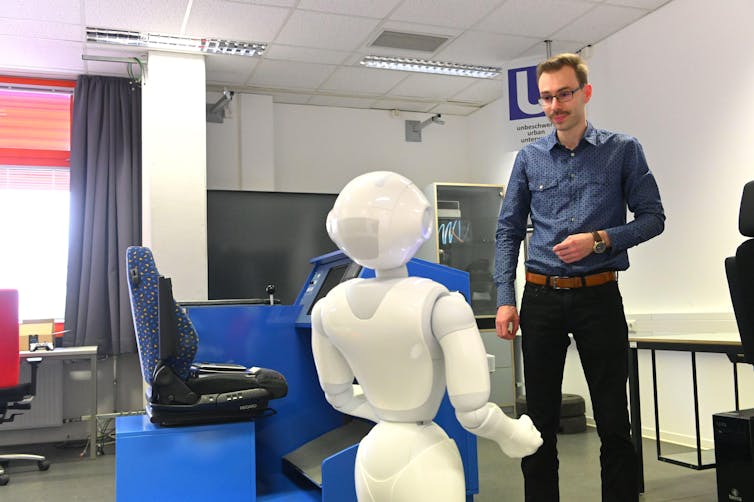 robot and academic working together