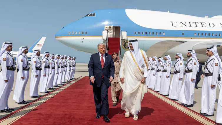 Sheikh Tamim bin Hamad al-Thani welcoming Donald Trump to Qatar as he disembarks from Air Force One.