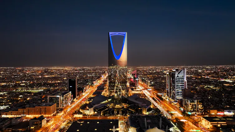 A city skyline seen at night.