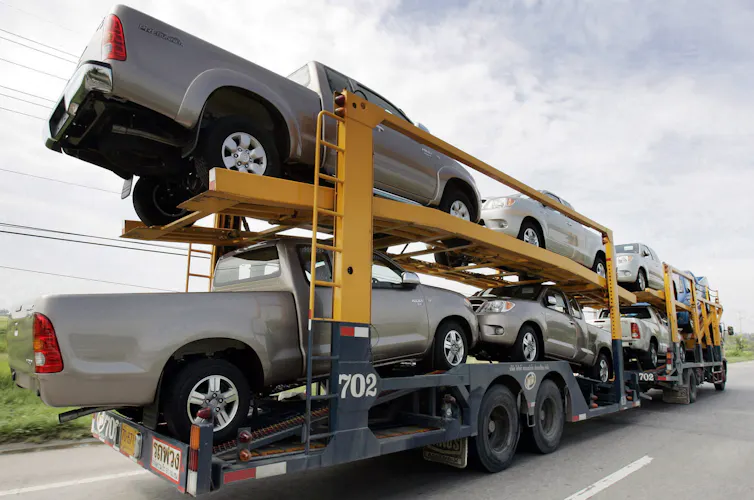 Grey pickup utes on a truck.