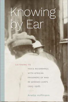 A book cover showing an old sepia image of the back of an African man as he walks, head bowed, led by a man in a military helmet.
