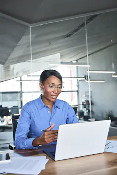 Woman conducting job interview on laptop