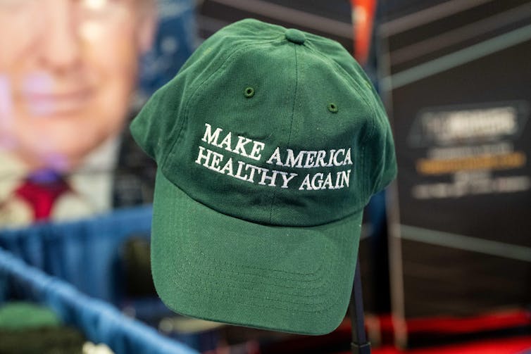A green cap is once again sewed in a white letter with the United States healthy.