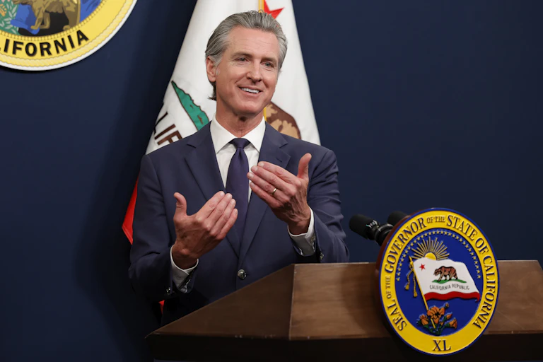 Gavin Newsom responds to questions during a press conference.