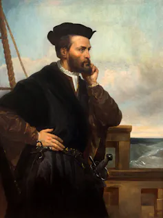 A portrait of a dark-haired bearded man on a ship.
