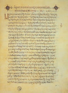 Yellowed piece of paper with Greek text on it.