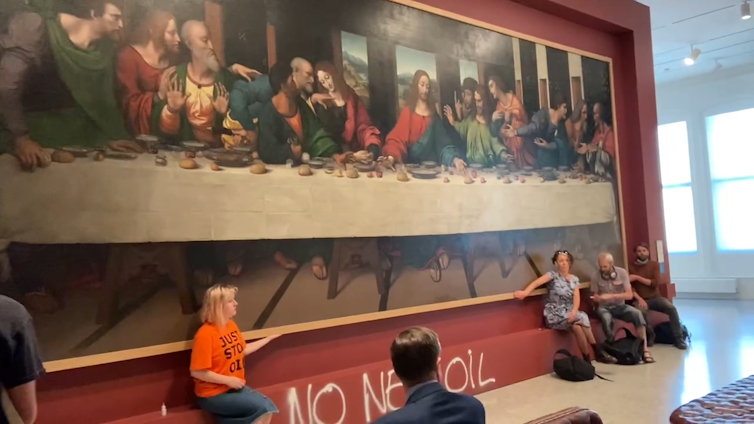Why do protestors use disruptive, confrontational techniques? New analysis displays they’re now not only a remaining hotel 1 Just Stop Oil protestors with hands glued to the frame of da Vinci's The Last Supper.