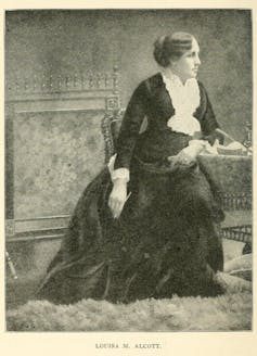 Girls within the literature: to be or to not be (unmarried)? 3 A portrait of a woman dressed in a black seating and leans on the table.