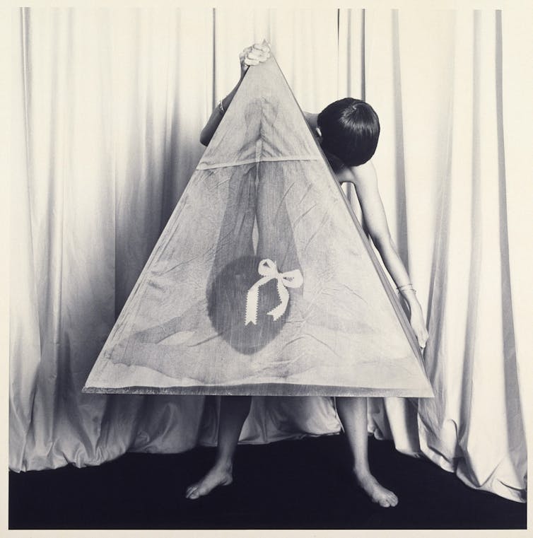 Helen Chadwick: Lifestyles Pleasures – a wealthy and witty retrospective that smells like chocolate 2 Chadwick holding a large photo of herself posed in a shape that looks like a vulva