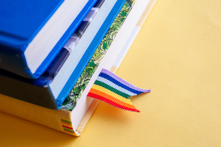 Books with a rainbow bookmark